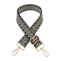 Detailed view of the black and white geometric woven replacement bag strap with gold hardware. - Black Beige