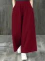 Detailed view of women's burgundy high waist wide leg pants, casual retro style trousers. - XL / Red