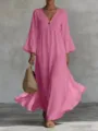 Detailed view of the flowy pink boho maxi dress featuring deep V-neck and stylish bell sleeves. - Pink