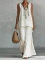 Casual bohemian white linen sleeveless v-neck vest and wide-leg pants set detail view. - Ivory