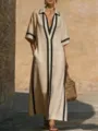 Elegante vestido maxi beige con ribetes negros contrastantes, solapa y bolsillos prácticos. - S / Albaricoque