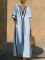 Dettaglio abito maxi azzurro chic con bordi neri a contrasto e vestibilità casual comoda. - Azzurro