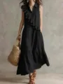 Vista detallada del elegante vestido midi negro sin mangas con volantes asimétricos. - S / Negro