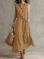 Detail view of the elegant sleeveless lapel long dress with ruffle trim in rich brown. - Khaki
