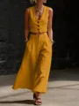 Primer plano detallado del elegante conjunto de chaleco corto sin mangas y pantalón ancho. - S / Superior E Inferior / Amarillo
