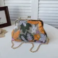 Vintage embroidered kiss lock chain crossbody bag, elegant floral shoulder handbag for women. - Orange