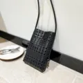 Black woven mini crossbody bag, chic hollow grid shoulder bag for women daily casual wear. - Black