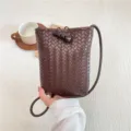 Mini brown woven crossbody phone bag for women, stylish leather-look small shoulder handbag. - Coffee