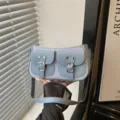 Trendy blue shoulder bag with dual pockets and chic buckle details for women daily. - Blue