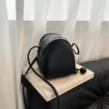 Borsa a tracolla mini testurizzata nera, elegante e pratica borsa da spalla donna. - Nero