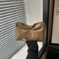 Elegant khaki leather clutch bag with chic bow design, stylish and modern accessory for women. - Khaki