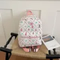 Cute cartoon print white bubble fabric backpack detail view with pink straps and sweet style. - Pink (With Pendant)