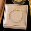 High-end gold plated titanium steel tennis bracelet with brilliant round CZ stones - 3mm Rhinestone Style (QZSLE2403) / Gold