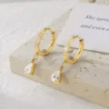 Elegant gold-plated hoop earrings with dangling pear-shaped moissanite stones - Pear Shape Moissanite Drop Style / Gold