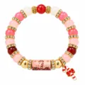 Christmas themed beaded bracelet featuring pink beads and candy cane charm accessory - Candy Cane Style