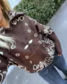 Brown knitted zip-up cardigan with white paisley prints for a casual lazy style - M / Tops / Brown