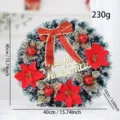 Detailed view of 40cm artificial Christmas wreath with red bow, poinsettia and gold leaves - Red Poinsettia