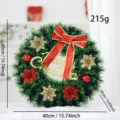 Artificial 40cm Christmas wreath with red bow, gold stars and Merry Christmas sign - Green Wreath With Bow