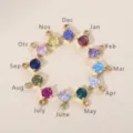 Set of 12 colorful 4mm round birthstone pendants in gold-plated settings - March Aquamarine Zirconia / Gold