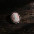 Elegant vintage cameo brooch with pink woman profile in an ornate silver frame - Cameo Portrait Style (Z745)