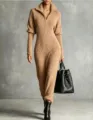 Close-up of camel knitted long-sleeve jumpsuit with high collar and half-zip detail. - S / Jumpsuits / Caramel color