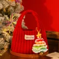 Festive red knitted Christmas gift bag with a colorful crochet tree charm detail - Red (Snowy Bell Pendant Style)