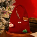 Red knitted Christmas gift bag with Santa and reindeer patches for holiday gifting - Wine Red (Santa Reindeer Style)