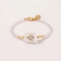 Handcrafted evil eye beaded necklace featuring clear faceted stones and gold zircon. - Bracelet / Transparent White