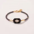 Elegante kralenketting met boze oog, natuursteen en sprankelende zirkonia in goudkleur - Armband / Irillerend Zwart