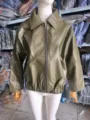 Detailed front view of an oversized olive green faux leather motorcycle jacket on a mannequin - S / Tops / Green