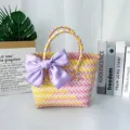 Hand-woven colorful basket bag featuring a large decorative purple satin bow detail - Small (With Pink Bow) / Yellow-Pink
