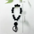 Schwarz-weißes Silikon-Perlen-Armband Schlüsselanhänger mit Blumenanhänger, 17 cm lang - Blume Schwarz