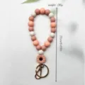 Weiches Silikon-Perlen-Armband für Schlüsselanhänger in Rosa und Weiß mit Blumen-Anhänger - Blumenkoralle