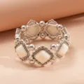 Vintage silver-tone elastic bracelet with white geometric acrylic rhombus inserts - White