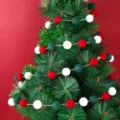 Festive Christmas felt ball garland featuring red, white, and green wool poms on a tree - 2m (25 Balls) / Red Green White