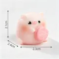 Miniature cute pink pig figurine holding a macaron for DIY dollhouse and desk decor - 2.3x2.1cm
