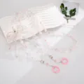 Elegante roze en witte parelachtige kralen crossbody tasketing met decoratieve strik - Strik Stijl / Roze
