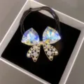 Chouchou élastique noir avec nœud en strass cristal brillant pour coiffures élégantes. - Couleur AB