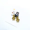 Close-up detail of cute resin glitter bear earrings on display card, stylish accessory. - Clip-on Earrings / Gold