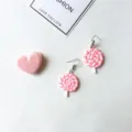 Detailed shot of cute pink and white spiral lollipop earrings with hook, sweet style. - Ear Hooks 1 Pair / Pink
