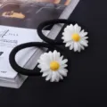 Black elastic hair ties featuring cute white daisy charms, sweet floral hair accessories detail. - Single Flower Hair Tie