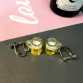 Detailed shot of cute novelty beer mug clip-on earrings, quirky resin design for women. - Clip-on Earrings / Yellow