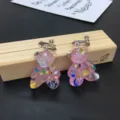 Handcrafted cute resin teddy bear clip-on earrings with colorful irregular glitter flakes. - Clip-On Earrings / Pink