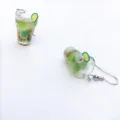 Close-up detail shot of cute resin fruit cocktail cup earrings featuring miniature lemon slices. - Green Lemon Earring Hook Style