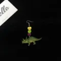 Dinosaur dangle earrings featuring colorful heart beads and a green dinosaur pendant for cute style. - Triceratops / Single Piece