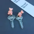 Cute pink resin bear and transparent glitter key drop earrings for sweet style daily wear. - Stud Earrings / Pink