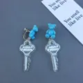 Blue cute bear clear key acrylic earrings detail view, sweet niche design fashion jewelry drops. - Clip-On Earrings / Blue