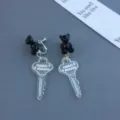 Black bear transparent key clip-on earrings, cute niche design sweet long pendant variant. - Clip-On Earrings / Black