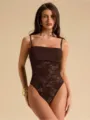 Detail shot of a sexy brown lace-spliced strappy one-piece bodysuit showcasing fine craftsmanship. - Coffee