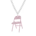Close up view of pink glitter acrylic folding chair pendant with silver chain necklace - Shiny Pink Necklace